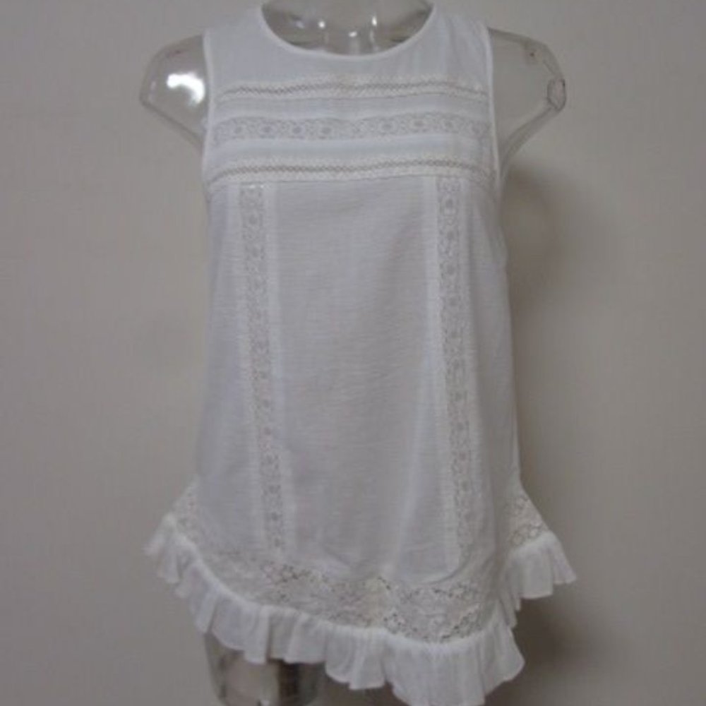 SLEEVELESS WOVEN TOP W/BOTTOM RUFFLE DETAIL OW